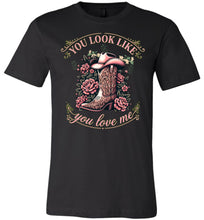 Load image into Gallery viewer, Black t-shirt with a graphic of a cowboy boot and floral design, text 'You look like you love me', on a white background.