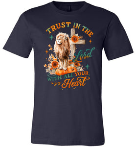 Navy blue t-shirt with a lion, cross, and pumpkin design on a white background
