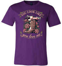 Load image into Gallery viewer, Purple t-shirt with a graphic of a cowboy boot and flowers, and text 'You look like you love me'.