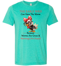 Load image into Gallery viewer, Teal t-shirt with a cartoon chicken wearing a bow and glasses, and humorous text on a white background.