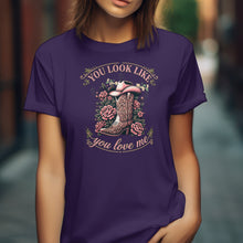 Load image into Gallery viewer, Person wearing a purple t-shirt with a cowboy boot and floral design and text. You Look Like You Love Me Shirt