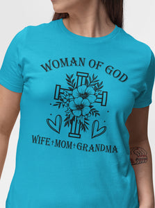 Turquoise t-shirt with 'Woman of God, Wife + Mom + Grandma' text and cross design.