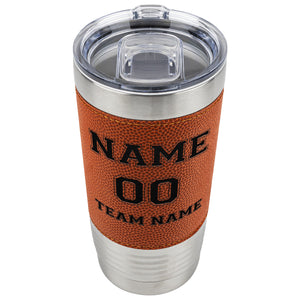 Tumbler with basketball-textured wrap and clear lid on a white background