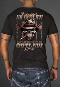 Black t-shirt with a graphic design featuring a skull wearing a cowboy hat and smoking a cigar, with text on the back.