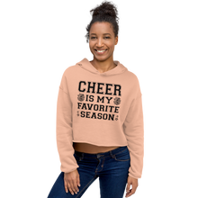 Load image into Gallery viewer, Woman wearing a peach hoodie with &#39;CHEER IS MY FAVORITE SEASON&#39; text on a white background
