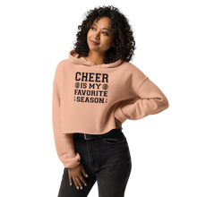 Load image into Gallery viewer, Woman wearing a peach hoodie with &#39;Cheer is my favorite season&#39; text on a white background
